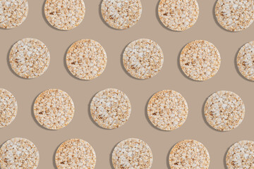 Fototapeta na wymiar Creative pattern of rice cakes on bright background. Healthy lifestyle concept. Top view.