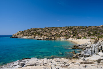 Fototapeta na wymiar View of the most amazing turquoise beach of Pikri Nero, on a beautiful day on the island of Ios Greece