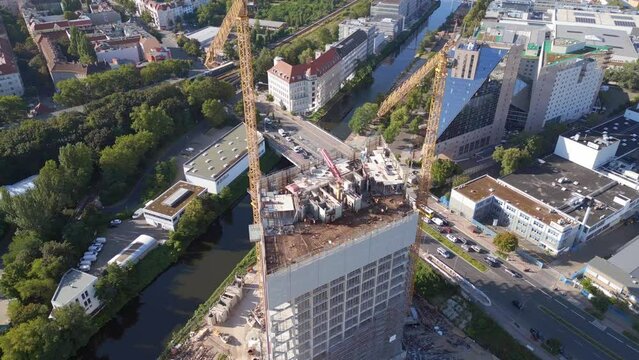 Berlin city construction crane on skyscraper Magic aerial top view flight drone