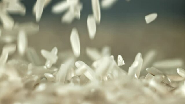 Falling rice grains. Filmed on a high-speed camera at 1000 fps. High quality FullHD footage