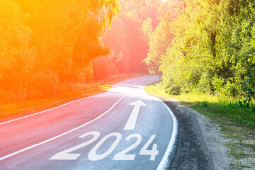 2024 2025 and arrow on the road in the forest concept, Tinted Image Selective Focus