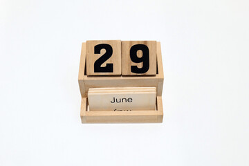 29th of June wooden perpetual calendar. Shot close up isolated on a white background
