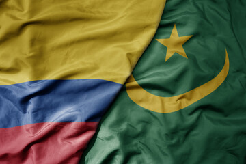 big waving national colorful flag of mauritania and national flag of colombia .