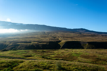 Fototapeta premium Mountain landscape with green grass and blue sky. Iceland, Europe.