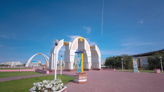 Timelapse Hyperlapse of the Entrance to Park Named after the First President in Aktobe City, Western Kazakhstan. A Stately Pathway into Tranquil Urban Beauty