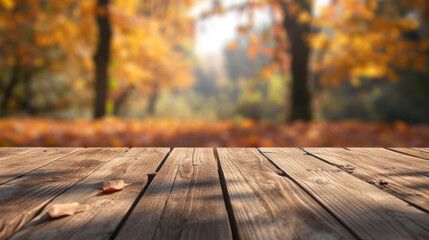 The empty wooden table top with blur background of autumn. Exuberant image.