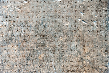 ancient greek letters in stone