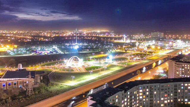 Park Illumination: Day to Night Transition Timelapse of Park Named after the First President in Aktobe City. Aerial Top View Showcasing the Charming Transformation in Western Kazakhstan