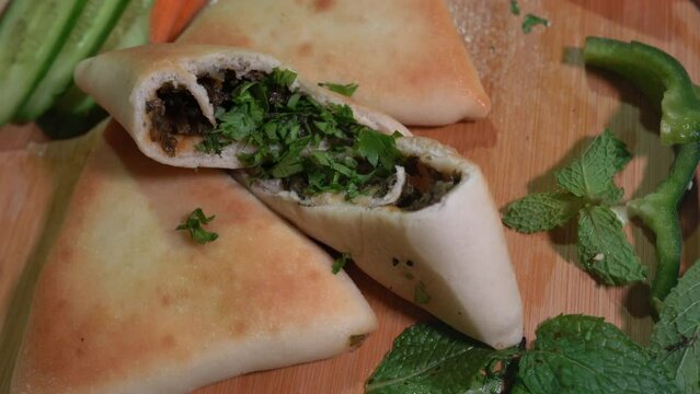 Lebanese Middle Eastern Manakish, Freshly baked Flatbread of cheese, thyme, chicken  and meat - Arabian food and Pastry - Levantine cuisine