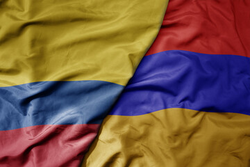Fototapeta premium big waving national colorful flag of armenia and national flag of colombia .
