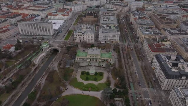 High angle view of historic Kursalon and park in city. Huge buildings and palaces in urban borough. Vienna, Austria