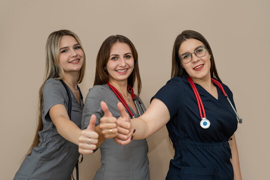 Portrait of three woman doctor, medical team wearing uniform's with stethoscope's isolated