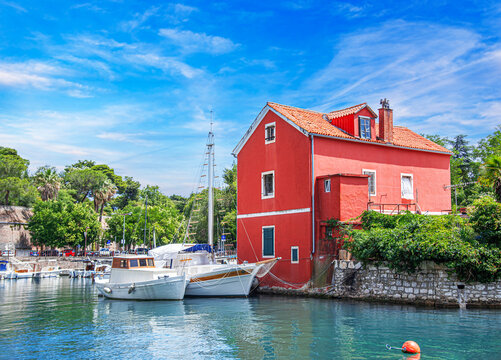 Fisherman's red house on the water. Croatia, Zadar.