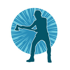 Silhouette of a worker in action pose using his axe tool.