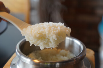 steamed sticky rice in stainless steel pot, korean style food