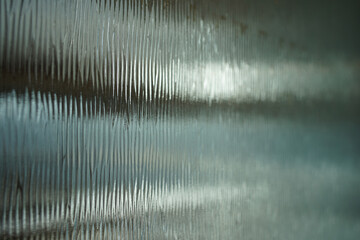 Abstract vertical patterned glass surface
