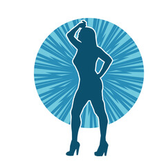 Silhouette of a young slim female model in tight outfit. Silhouette of a slim woman in feminine pose.