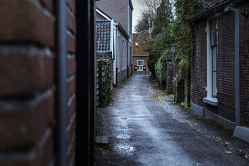 Moody alley in old dutch village.