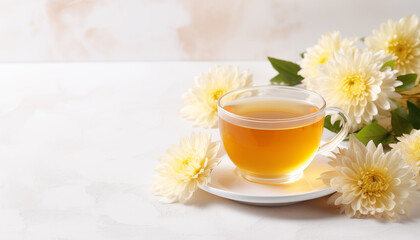 Obraz na płótnie Canvas Chrysanthemum flower tea in cup with flowers. Refreshing healthy beverage for drink. Herbs and medical concept, copy space