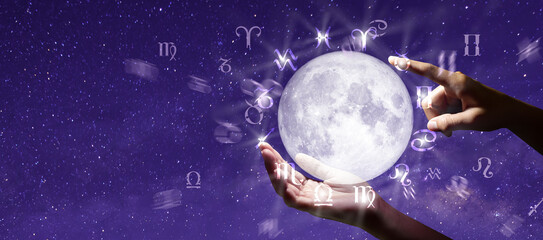 Astrological zodiac signs over the moon in hand. Knowledge of the stars in the sky. The power of...
