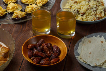 set table meat bread couscous uzvar for iftar ramadan meal.