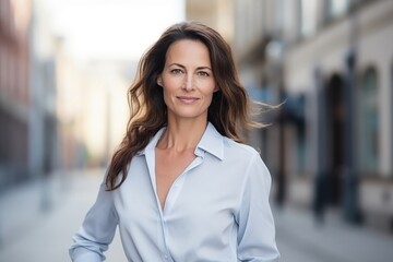 Portrait of a beautiful mature businesswoman standing in the street.