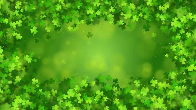 Rectangular animated frame with shamrocks on an abstract green looped background with beautiful bokeh. Copy space.