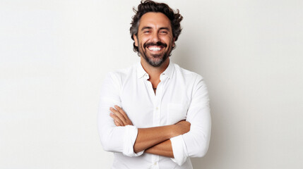 Portrait of a happy latin man with arms crossed against white background - obrazy, fototapety, plakaty
