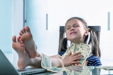 A young girl counting US Dollar bills profit. Business concept. Horizontal image.