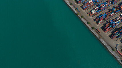 Fototapeta na wymiar container,container ship in import export and business logistic.By crane , Trade Port , Shipping.Tugboat assisting cargo to harbor.Aerial view.