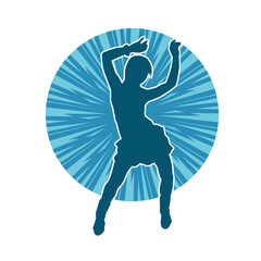 Silhouette of a female dancer wearing mini skirt in action pose. Silhouette of a slim woman dancing happily.