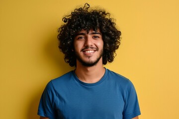 a man with curly hair smiling