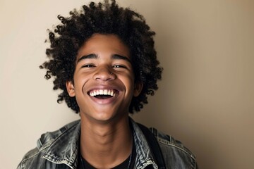 a man with curly hair laughing