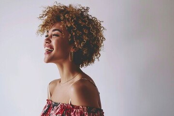 a woman smiling with curly hair
