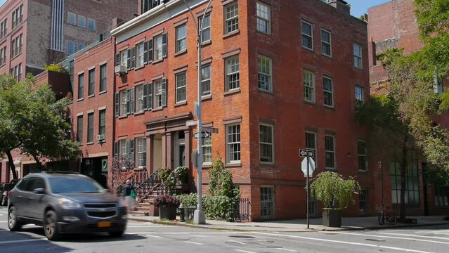 A typical daytime New York City apartment building establishing shot.