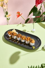 Salmon Tartare Sushi Roll Adorned with Unagi Sauce and Pistachio. Suitable for upscale dining and...