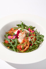 Italian salad with burrata, tomatoes, and arugula, elegantly arranged and garnished with edible flowers