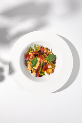 Mediterranean salad with octopus, potatoes, tomatoes, and Kalamata olives, served with a spicy...