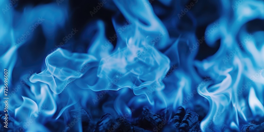 Poster Close-up view of a fire with intense blue flames. Perfect for adding a vibrant and captivating element to any project