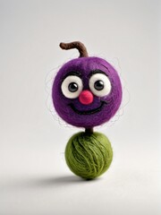 Photo Of A Needle-Felted Cartoon Damson Character Isolated On A White Background