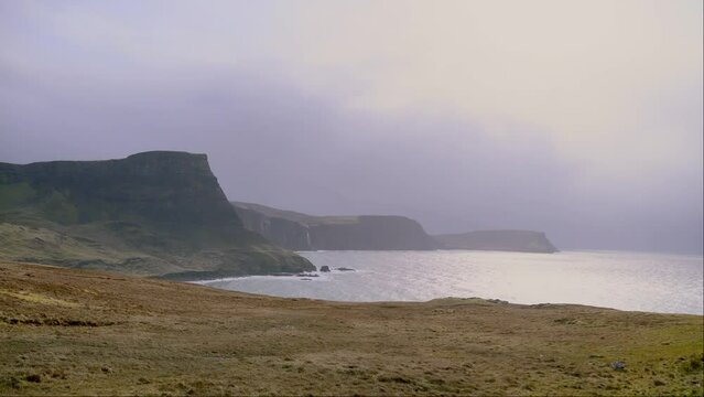 View of beautiful countryside in the Scottish highland with mountains, trees and sea