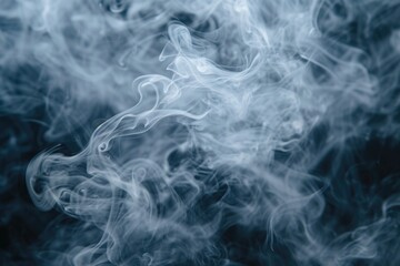 Obraz premium Smoke captured in a close up shot on a black background. Can be used to create a mysterious or dramatic atmosphere in various design projects