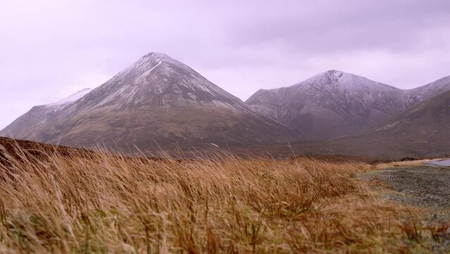 View of beautiful countryside in the Scottish highland with mountains, trees and sea