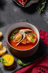Tomato soup with seafood and rouille sauce served with ciabatta, aesthetically pleasing winter menu