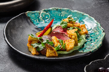 Marbled beef steak with crispy eggplants and wasabi puree, aesthetically pleasing and gourmet