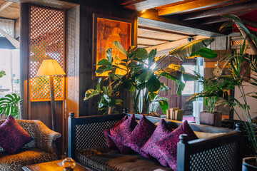 Sotogrante, Spain - January 25, 2024 - A cozy interior with a leopard print armchair, wooden walls,...