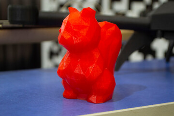 Art object model of squirrel printed on 3D printer. Toy created by 3D printing from molten plastic....
