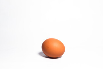 Brown eggs on white background