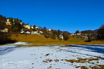 Buildings above a field at Bled in Slovenia