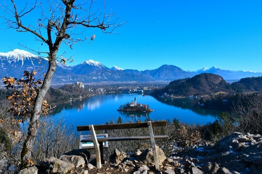 View of lake Bled in Slovenia from Ojstrica hill with a bench at the top